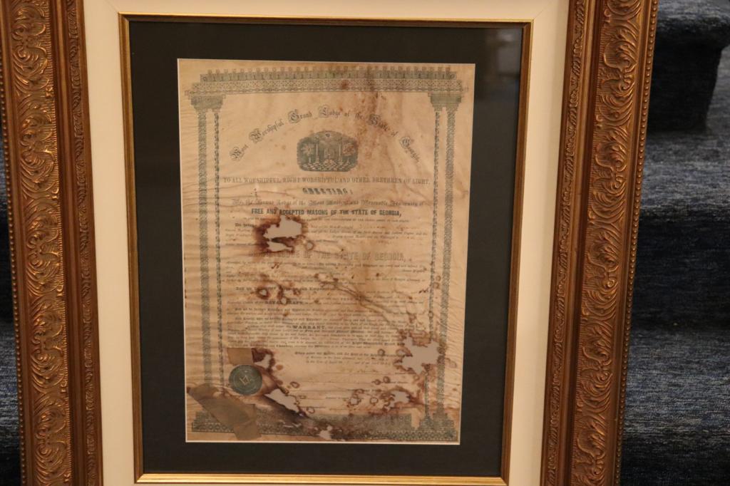 The original lodge charter preserved after being damaged in a fire